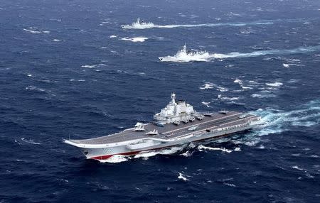 China's Liaoning aircraft carrier with accompanying fleet conducts a drill in an area of South China Sea, in this undated photo taken December, 2016. REUTERS/Stringer/File photo