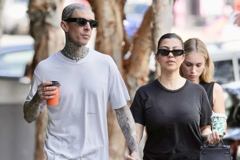 <p>Backgrid AU / BACKGRID</p> Travis Barker and Kourtney Kardashian in Brisbane