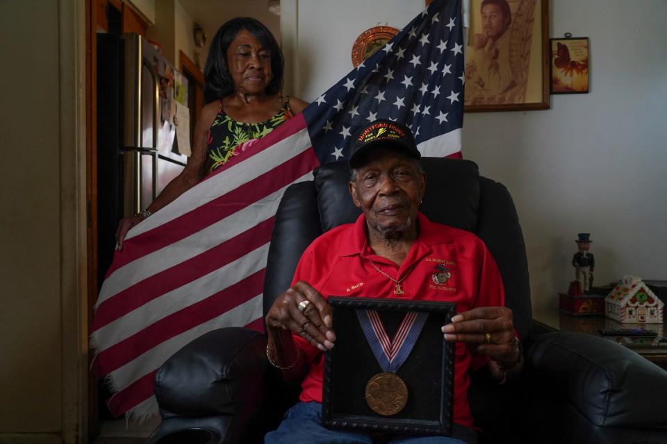 Montford Point Marine Butler Martin, 101, of Inkster, and his wife Anna Martin, 85, sit at their home as he talks about what It was like for him being a part of the the first group of African Americans to enlist in the U.S. Marine Corps. While sitting at his home in Inkster on Thursday, May 23, 2024. Martin who was given the Congressional Gold Medal with other members of the Montford Point Marines, was also honored by the city of Southfield at a ceremony put together by the Southfield Veteran's Commission.