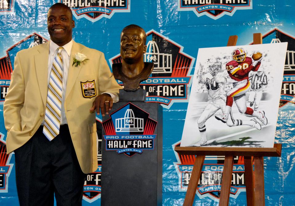 Texas A&I great Darrell Green formerly of the Washington Redskins  poses with his bust after his induction during the  Class of 2008 Pro Football Hall of Fame Enshrinement Ceremony.
(Photo by Al Messerschmidt/Getty Images)