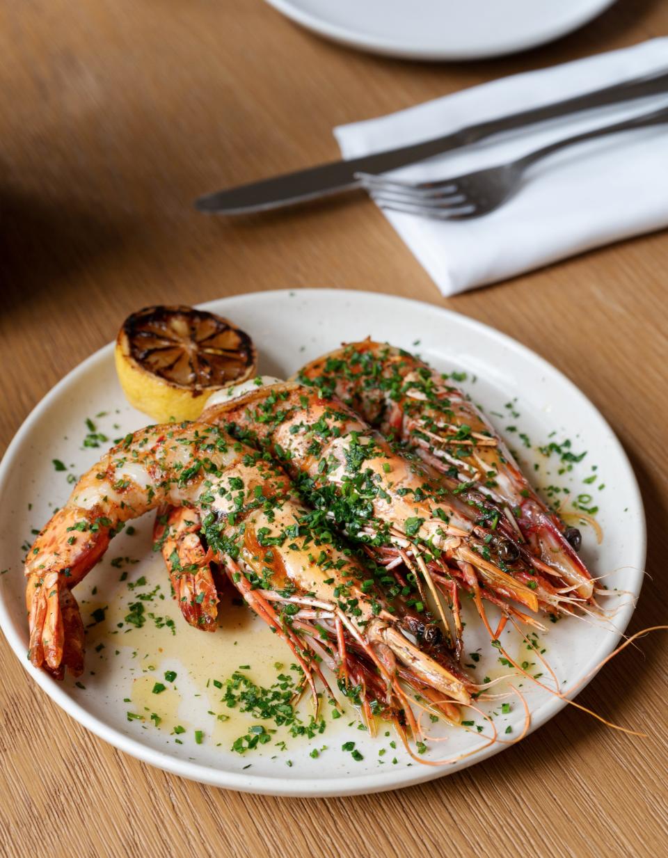 The newly-opened The Blue Door, along the Dixie Corridor, features a Mediterranean-inspired menu created by executive chef and co-owner Nano Cresp. There is a heavy emphasis on seafood like the wild prawn entree.