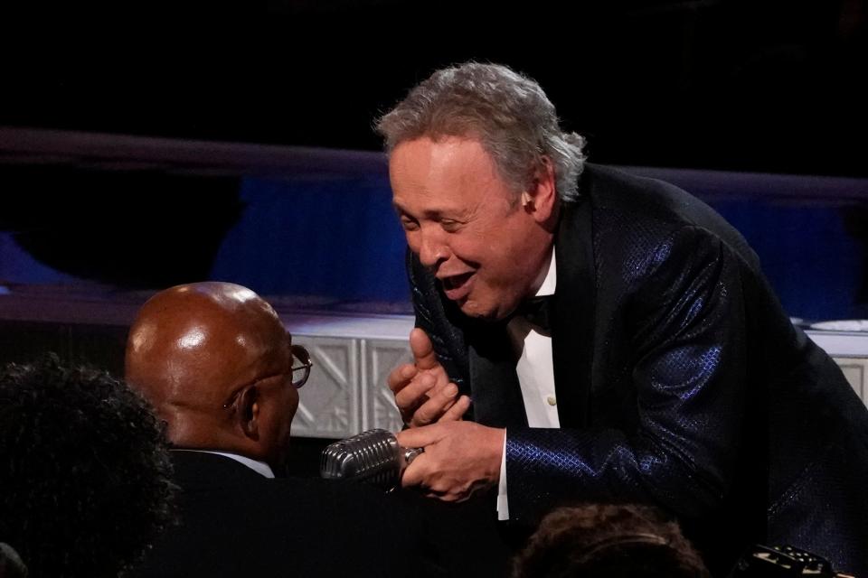Billy Crystal interacts with Samuel L. Jackson in the crowd as he performs songs from "Mr. Saturday Night" during the 75th Annual Tony Awards on Sunday, June 12.