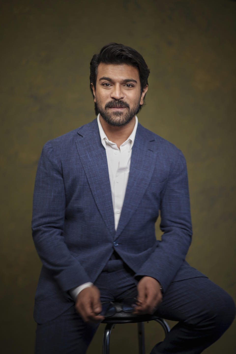 Indian actor Ram Charan poses for a photo to promote the film "RRR" on Monday, Jan. 9, 2023, in Los Angeles. (AP Photo/Damian Dovarganes)