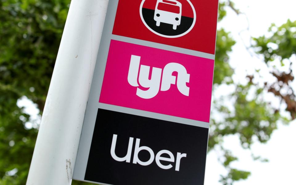 A sign marks a rendezvous location for Lyft and Uber users at San Diego State University in San Diego, California - Mike Blake /REUTERS