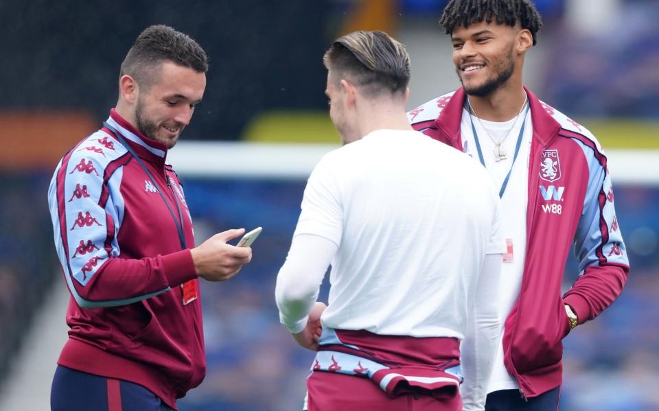 John McGinn (left) is particularly close with Jack Grealish (centre) - IAN HODGSON