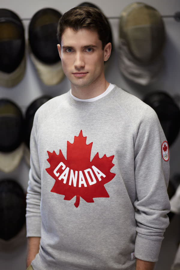 Fencer Philippe Beaudry poses in the new Olympic sweatshirt.