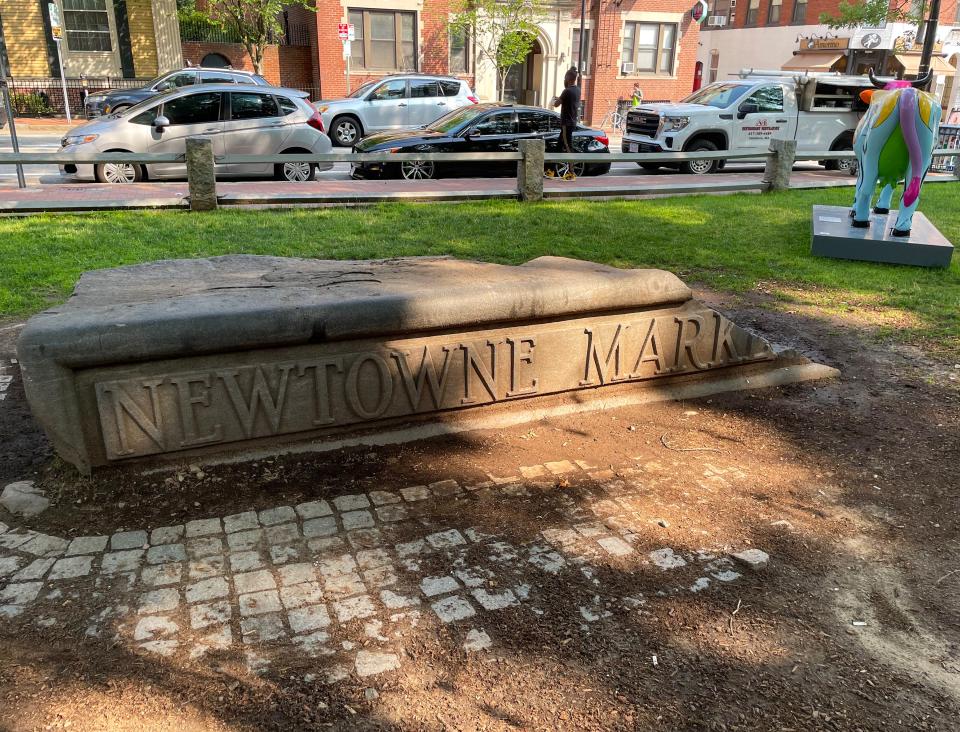 A stone marker in Winthrop Square off JFK Street.