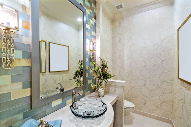 Jodi Jacobson/E+ Collection/Getty Images Stock image of a bathroom sink and vanity set up