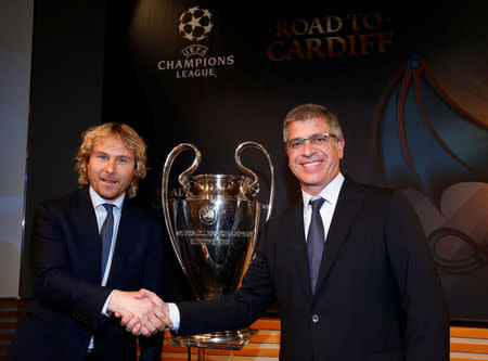 Juventus' Vice Chairman Pavel Nedved (L) shakes hands with FC Barcelona's Vice President Jordi Mestre after the draw of the UEFA Champions League quarterfinals in Nyon, Switzerland March 17, 2017. REUTERS/Denis Balibouse