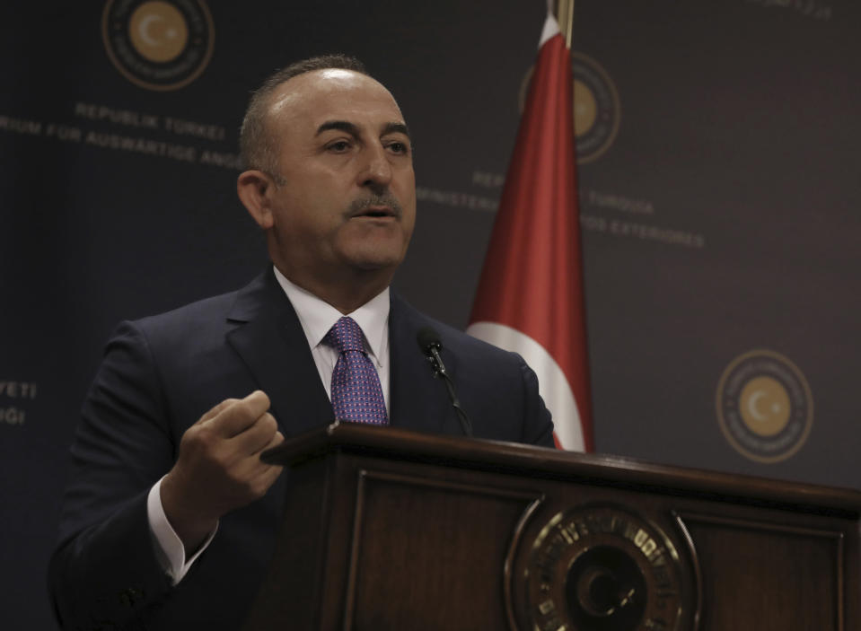 Turkey's Foreign Minister Mevlut Cavugoglu speaks during a news conference in Ankara, Turkey, Wednesday, July 24, 2019. Cavusoglu says a new U.S. proposal concerning the creation of a possible "safe zone" in northern Syria was not "satisfactory".(AP Photo/Burhan Ozbilici)