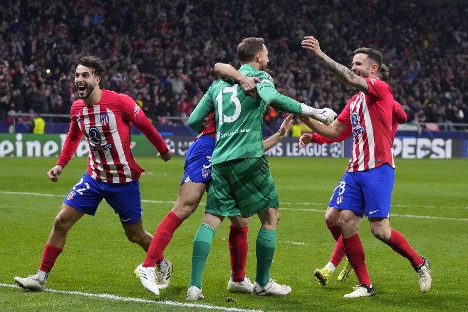 Atletico Madrid players celebrate winning the Champions League, round of 16, second leg soccer match against Inter Milan at the Metropolitano stadium in Madrid, Spain, Wednesday, March 13, 2024. Atletico Madrid won 3-2 in a penalty shootout. (AP Photo/Manu Fernandez)