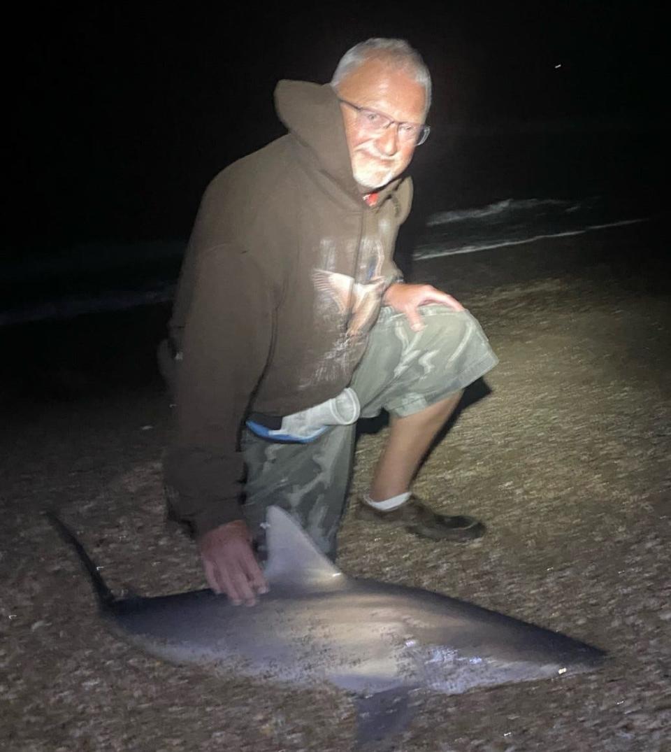 Jimbo, from Illinois, with a blacknose shark brought to shore with the help of NSB Shark Hunters.