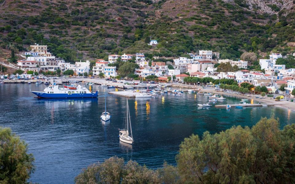 The main harbour of Fourni Korseon, where white houses glitter in the sun