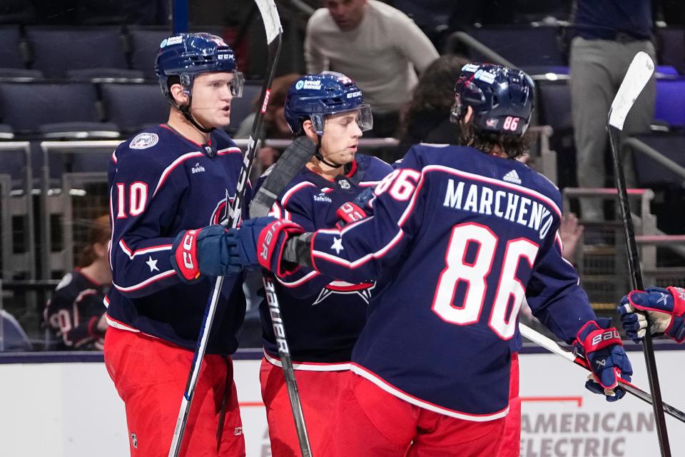 Mar 4, 2024; Columbus, Ohio, USA; The “Russian line” of Columbus Blue Jackets left wing Dmitri Voronkov (10), right wing Yegor Chinakhov (59) and right wing Kirill Marchenko (86) celebrate a goal by Chinakhov during the third period of the NHL hockey game against the Vegas Golden Knights at Nationwide Arena. The Blue Jackets won 6-3.