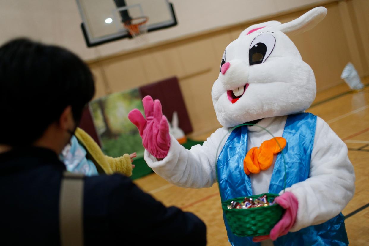 The Easter Bunny welcomes kids and parents to the Heard Park "Egg-Stra Special Easter egg hunt" in Athens, Ga., on Saturday, April 9, 2022.