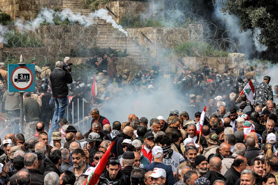 Tear gas fills the air during a demonstration by retired Lebanese army and security forces veterans, demanding inflation-adjustments to their pensions, outside the government palace headquarters in the center of Beirut, Lebanon, March 22, 2023. / Credit: ANWAR AMRO/AFP/Getty