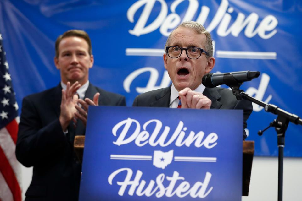 Ohio Attorney General Mike DeWine, right (AP Photo/John Minchillo)