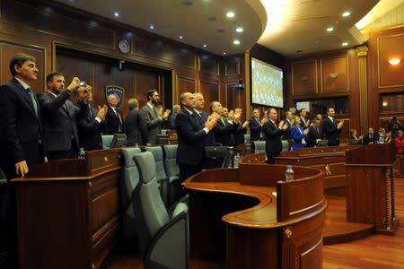 Kosovo's parliament speaker Kadri Veseli and lawmakers applaud after parliament approved formation of national Kosovo army in Pristina, Kosovo, December 14, 2018. REUTERS/Laura Hasani