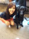 Son Dam Bi posing with a dog during shooting