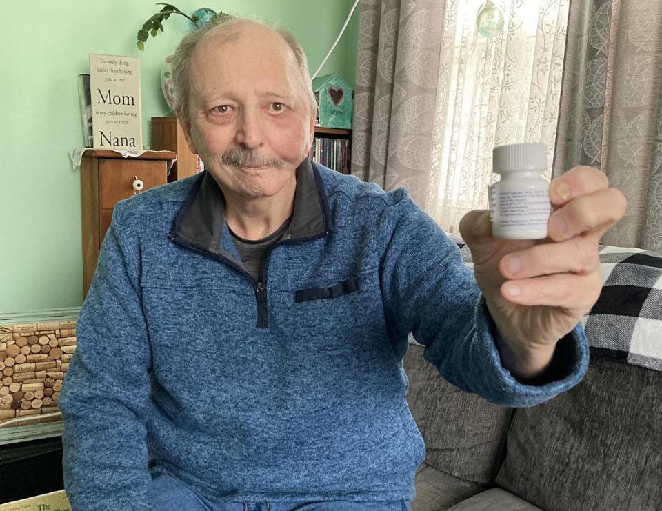 Michael Callahan, a 67-year-old retired Erie firefighter, shows the oral chemotherapy drug he took as part of a UPMC Hillman Cancer Center clinical trial to fight his neck and head cancer.