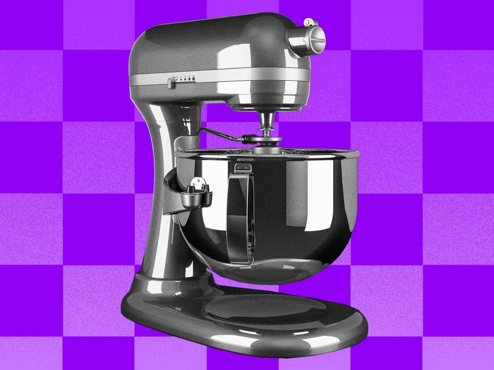A standing mixer on a purple checkered background