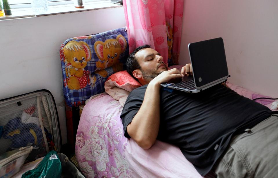 man with laptop at home