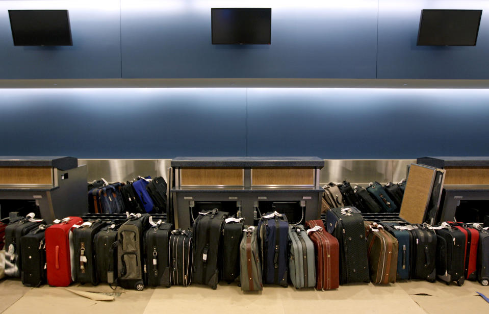 Luggage waits to be run through the baggage system for testing in the new Maynard Holbrook Jackson Jr. International Terminal at Atlanta's airport Wednesday, March 28, 2012. The new $1.4 billion international terminal at the world's busiest airport will be a sleek launching pad for millions of passengers that’s designed to help Atlanta grab a growing share of the lucrative market for global travelers. (AP Photo/David Goldman)