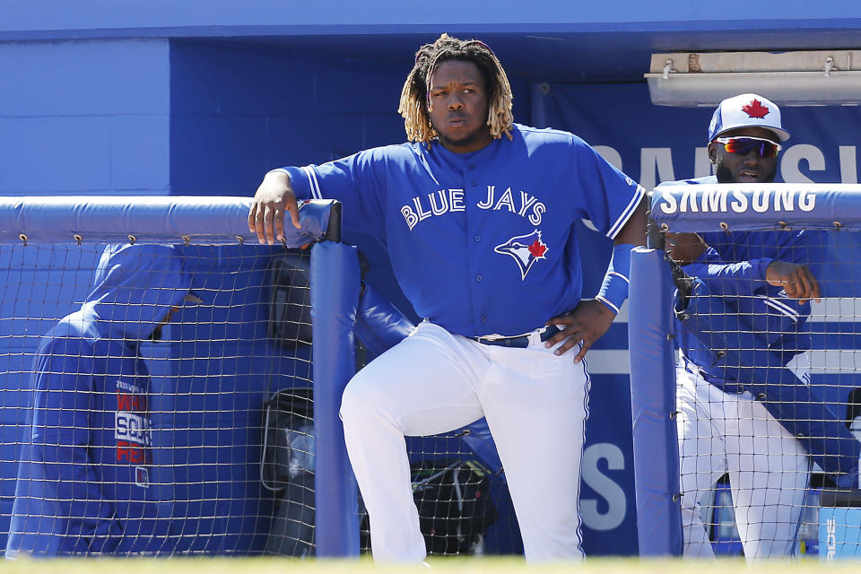 DUNEDIN, FLORIDA - MARCH 06:  Vladimir Guerrero Jr. #27 of the Toronto Blue Jays looks on from the dugout against the Philadelphia Phillies during the Grapefruit League spring training game at Dunedin Stadium on March 06, 2019 in Dunedin, Florida. (Photo by Michael Reaves/Getty Images)