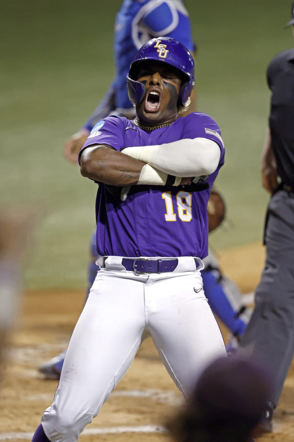 LSU first baseman Tre' Morgan (18) reacts after hitting a home run during the third inning of an NCAA college baseball tournament super regional game against Kentucky in Baton Rouge, La., Saturday, June 10, 2023. (AP Photo/Tyler Kaufman)