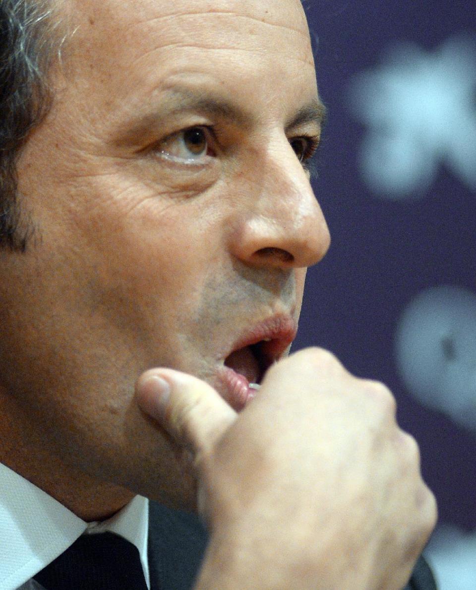 FC Barcelona's President Sandro Rosell, touches his face during a press conference at the Camp Nou stadium in Barcelona, Spain, Thursday, Jan 23, 2014. Sandro Rosell is stepping down as president of Barcelona a day after a judge agreed to hear a lawsuit accusing him of allegedly hiding the cost of the transfer of Brazil striker Neymar. Rosell says he is resigning after an emergency meeting with Barcelona's board of directors on Thursday. Rosell says vice president Josep Bartomeu will take his place as president and finish the term that expires in 2016. Elected in 2010 to replace outgoing president Joan Laporta, Rosell said last April he planned to run for re-election in 2016. (AP Photo/Manu Fernandez)