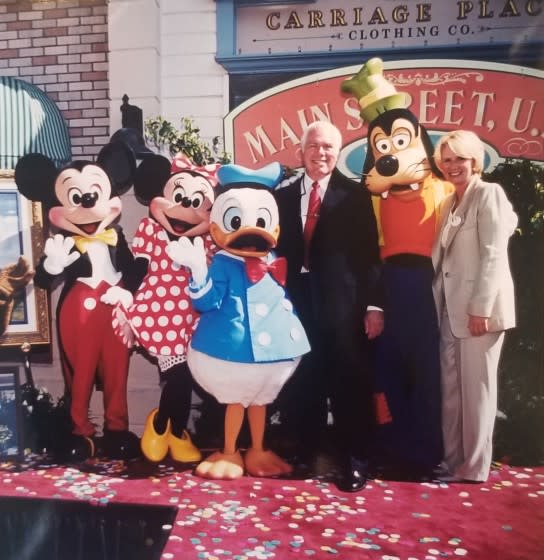 Disneyland master illustrator Charles Boyer, with famous Disney characters and Disneyland Vice President TK.