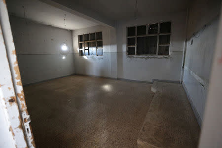 A classroom used as a prison by Islamic State militants is pictured inside the 'Aisha Mother of the BelieversÕ school which was recently reopened after rebels took control of al-Rai town from them, Syria January 17, 2017. Picture taken January 17, 2017. REUTERS/Khalil Ashawi