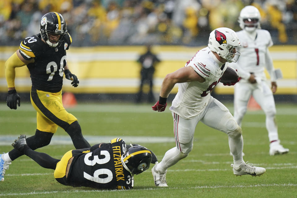 Arizona Cardinals tight end Trey McBride, right, breaks away from Pittsburgh Steelers safety Minkah Fitzpatrick (39) and Steelers linebacker T.J. Watt during the first half of an NFL football game, Sunday, Dec. 3, 2023, in Pittsburgh. (AP Photo/Matt Freed)