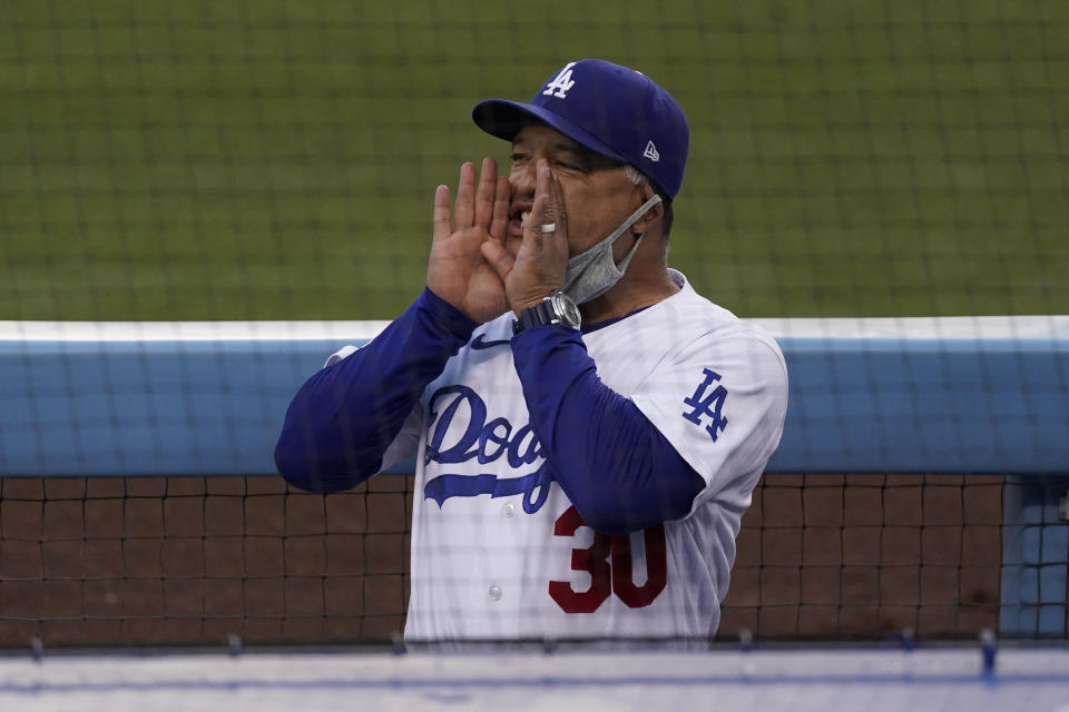 Los Angeles Dodgers manager Dave Roberts yells from the dugout before a baseball game against the Los Angeles Angels, Saturday, Sept. 26, 2020, in Los Angeles. (AP Photo/Ashley Landis)