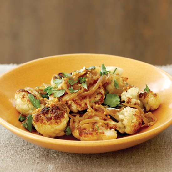 <p>Cauliflower may not seem like a glamorous vegetable—at least not when you steam or boil it. But roast it and it develops an unusual, delicate sweetness that’s almost exotic.</p><p><a href="https://www.foodandwine.com/recipes/cauliflower-with-melted-onions-and-mustard-seeds" rel="nofollow noopener" target="_blank" data-ylk="slk:GO TO RECIPE;elm:context_link;itc:0;sec:content-canvas" class="link ">GO TO RECIPE</a></p>
