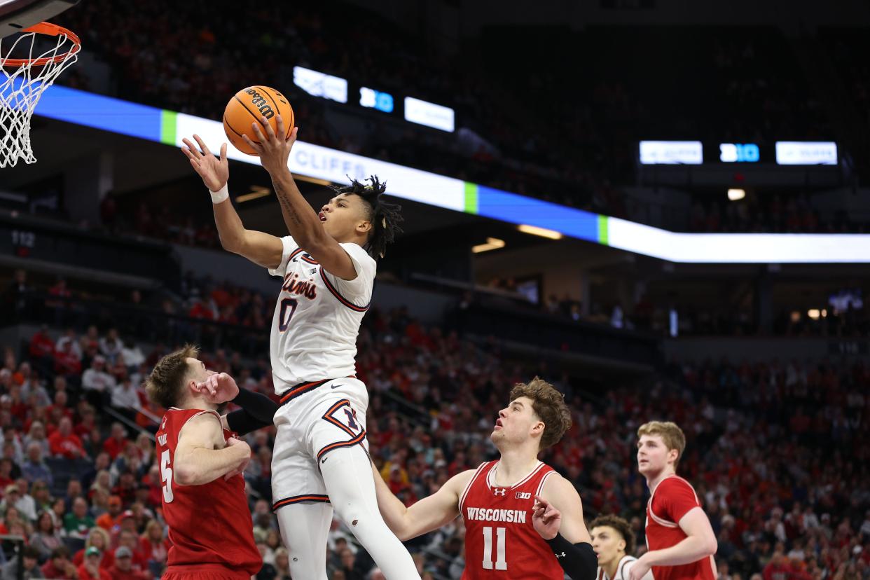 Illinois guard Terrence Shannon Jr. goes to the basket over Wisconsin forward Tyler Wahl in the second half at Target Center.