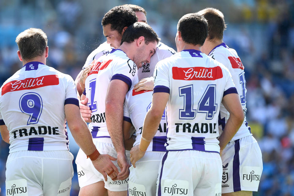 Melbourne Storm players, pictured here in action against the Gold Coast Titans.