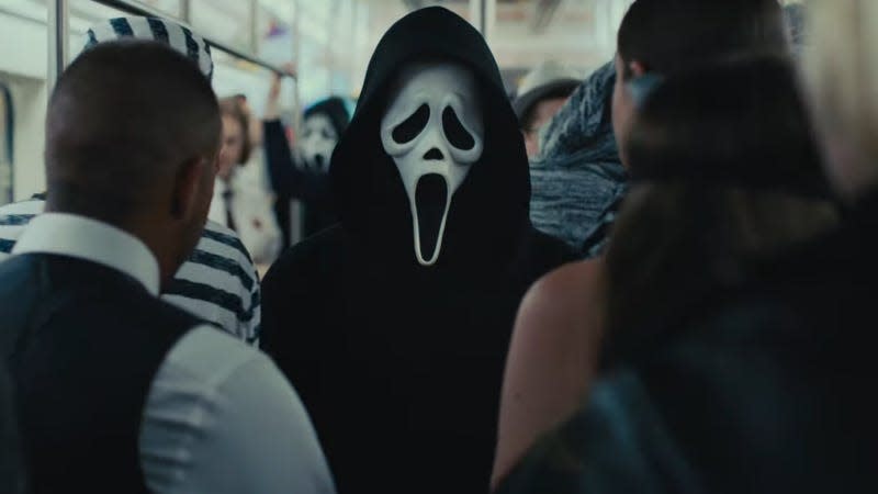 Ghostface stares menacingly on a crowded New York City subway car.