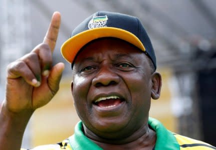 FILE PHOTO: South Africa's Deputy President Cyril Ramaphosa gestures at an election rally of the ruling African National Congress (ANC) in Port Elizabeth, South Africa April 16, 2016. REUTERS/Mike Hutchings/File Photo