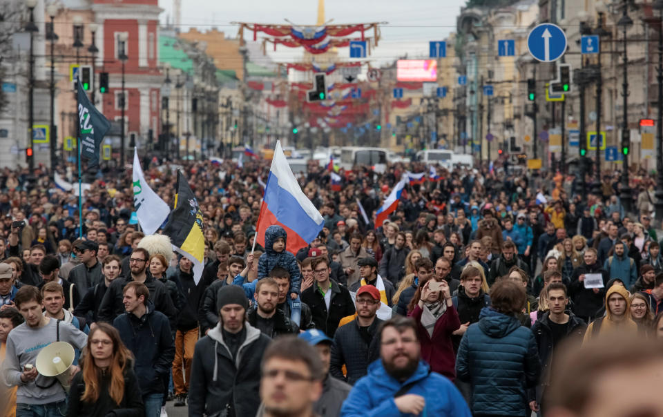 Opposition supporters walk during a protest rally ahead of President Vladimir Putin's inauguration ceremony, in St. Petersburg, Russia May 5, 2018. REUTERS/Anton Vaganov