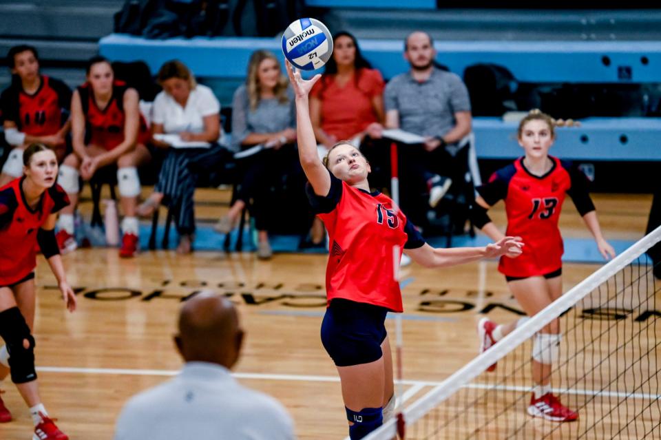 Lakewood's Alivia Everitt spikes the ball during the match against Lansing Catholic on Tuesday, Sept. 26, 2023, at Lansing Catholic High School in Lansing.