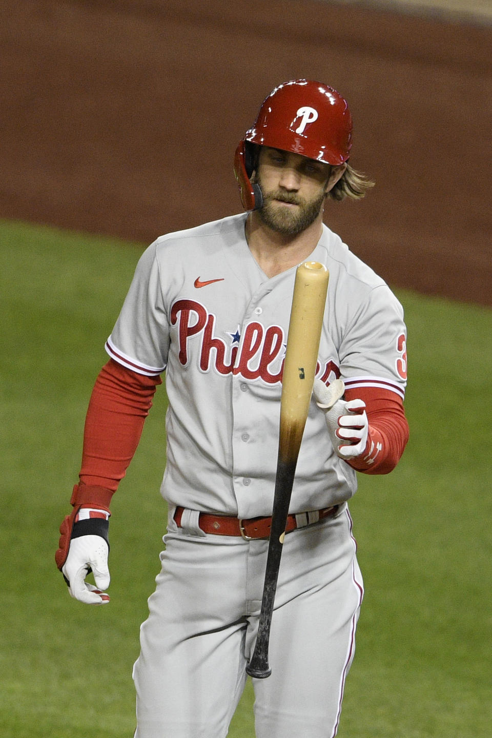 Philadelphia Phillies' Bryce Harper reacts after striking out during the fifth inning of a baseball game against the Washington Nationals, Monday, Sept. 21, 2020, in Washington. (AP Photo/Nick Wass)