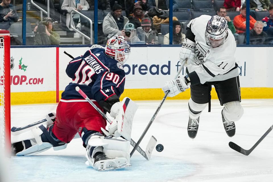 Dec 5, 2023; Columbus, Ohio, USA; Columbus Blue Jackets goaltender Elvis Merzlikins (90) stops a shot from Los Angeles Kings center Anze Kopitar (11) during the second period of the NHL game at Nationwide Arena.