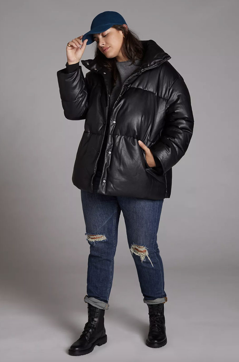 black anthropologie Faux Leather Puffer Coat plus size model wearing jeans and boots