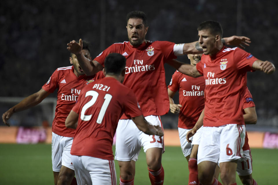 Benfica's players celebrate their sides first goal against PAOK during the Champions League playoffs, second leg, soccer match between PAOK and Benfica at theToumba stadium in the northern Greek port city of Thessaloniki, on Wednesday, Aug. 29, 2018. (AP Photo/Giannis Papanikos)