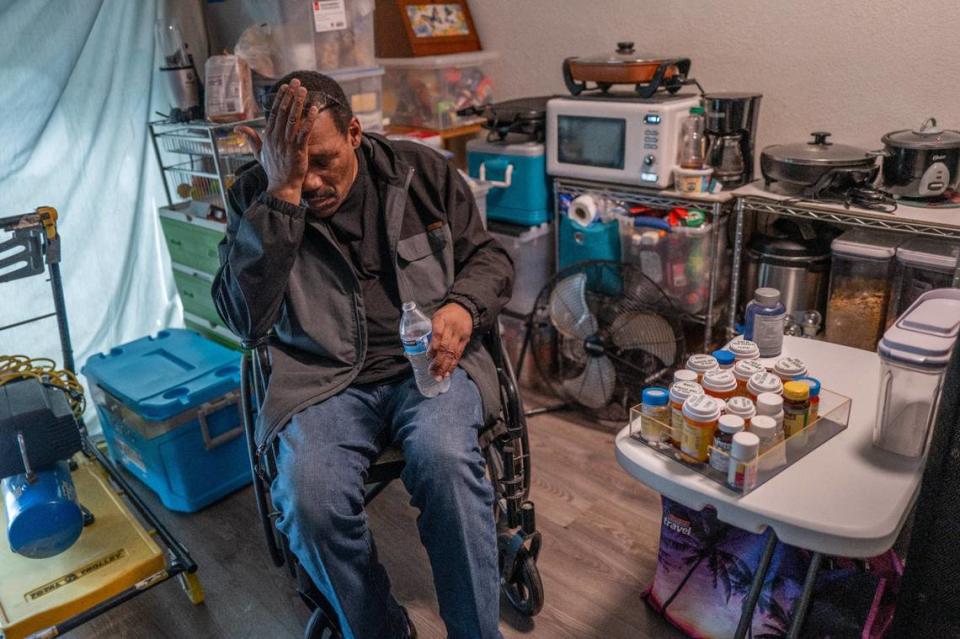Shawn White, 62, who suffers from spinal stenosis and a degenerative disk disease, sits stressed out and in pain in his wheelchair on March 28, as he and his wife Brenda faced eviction at the end of the month from the former Auburn Oaks Care Center in Citrus Heights. The couple moved to the complex, once a senior living facility, from a motel that was part of Project Roomkey, the state’s program to house the homeless during the COVID pandemic.