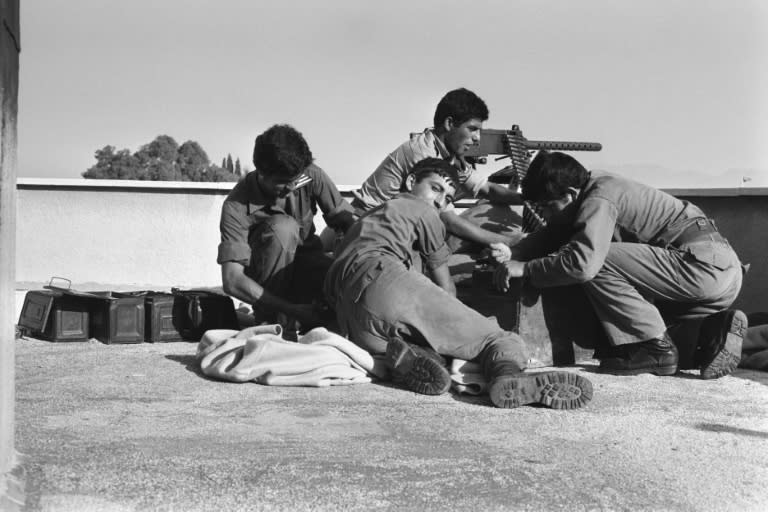 Greek Cypriot soldiers mount a 50mm machine gun on the roof of the Ledra Palace Hotel in 1974 after the Turkish invasion of Cyprus (Xavier BARON)