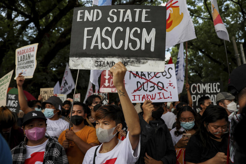 Activists protest against presidential frontrunner Ferdinand "Bongbong" Marcos and running mate Sara Duterte, daughter of the current president, during a rally at the Commission on Human Rights in Quezon City, Metro Manila, Philippines on Wednesday. May 25, 2022. Marcos Jr. continues to lead in the official canvassing of votes. (AP Photo/Basilio Sepe)