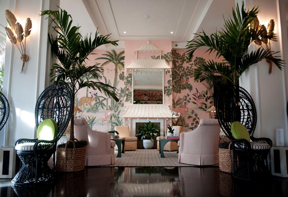 The Colony lobby features a pagoda, vintage and new furniture and de Gournay hand-painted wallpaper.