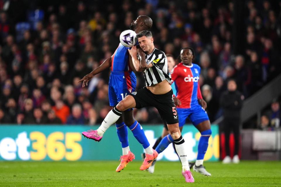 Fabian Schar challenges Jean-Philippe Mateta during Newcastle's defeat to Crystal Palace <i>(Image: PA)</i>